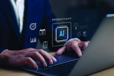 professional using AI on their laptop
